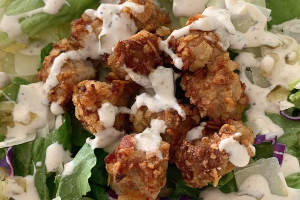 First-place winner Prairie Fresh® and Pickle recipe: Triple Pickle Caesar Salad with Crispy Pork Croutons, made with pickle chip-crusted Prairie Fresh® pork tenderloin and dill pickle Caesar dressing.