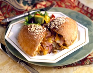 Ham and Cheese Calzone w/ Caramelized Yellow Peppers and Onions | Prairie Fresh®