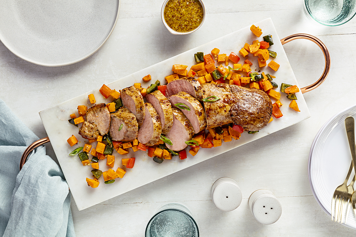 Garlic Dijon Pork Tenderloin with Roasted Sweet Potato and Pepper Jumble | Prairie Fresh®